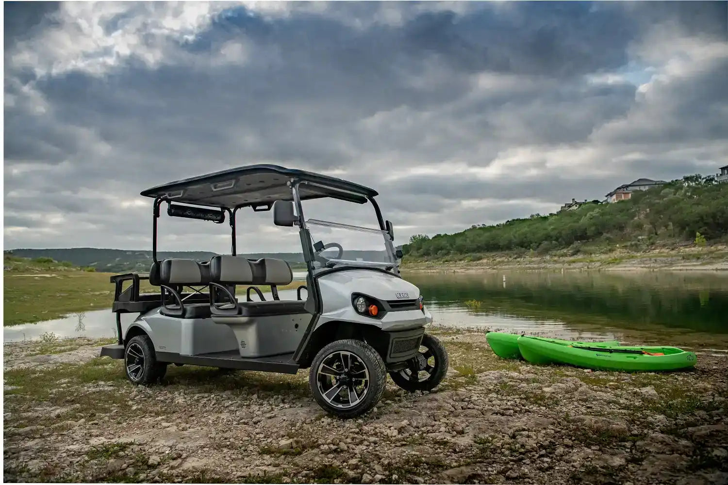 Gray golf cart with seating for six.
